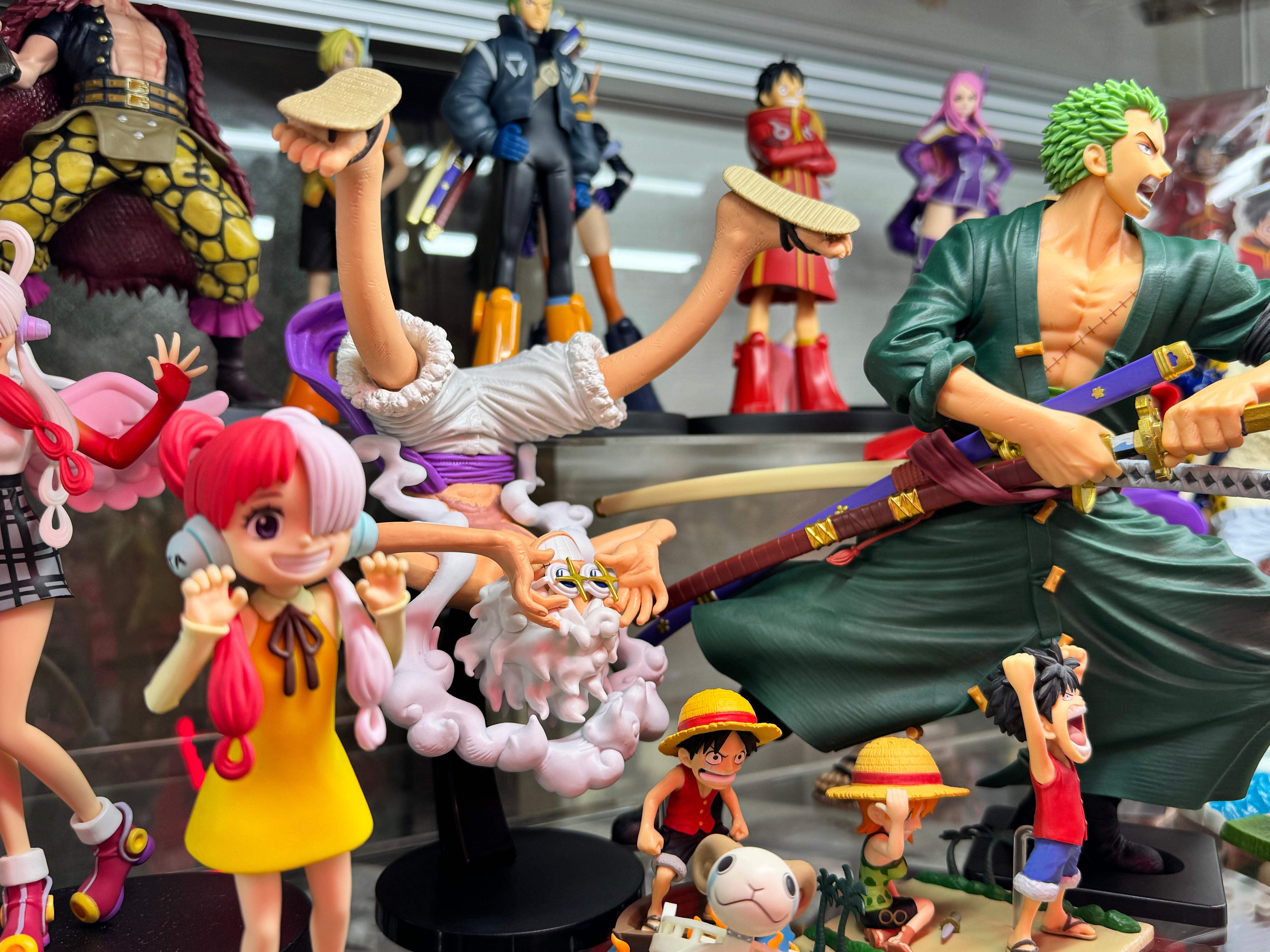 One Piece action figures of Zoro, Luffy, and more
